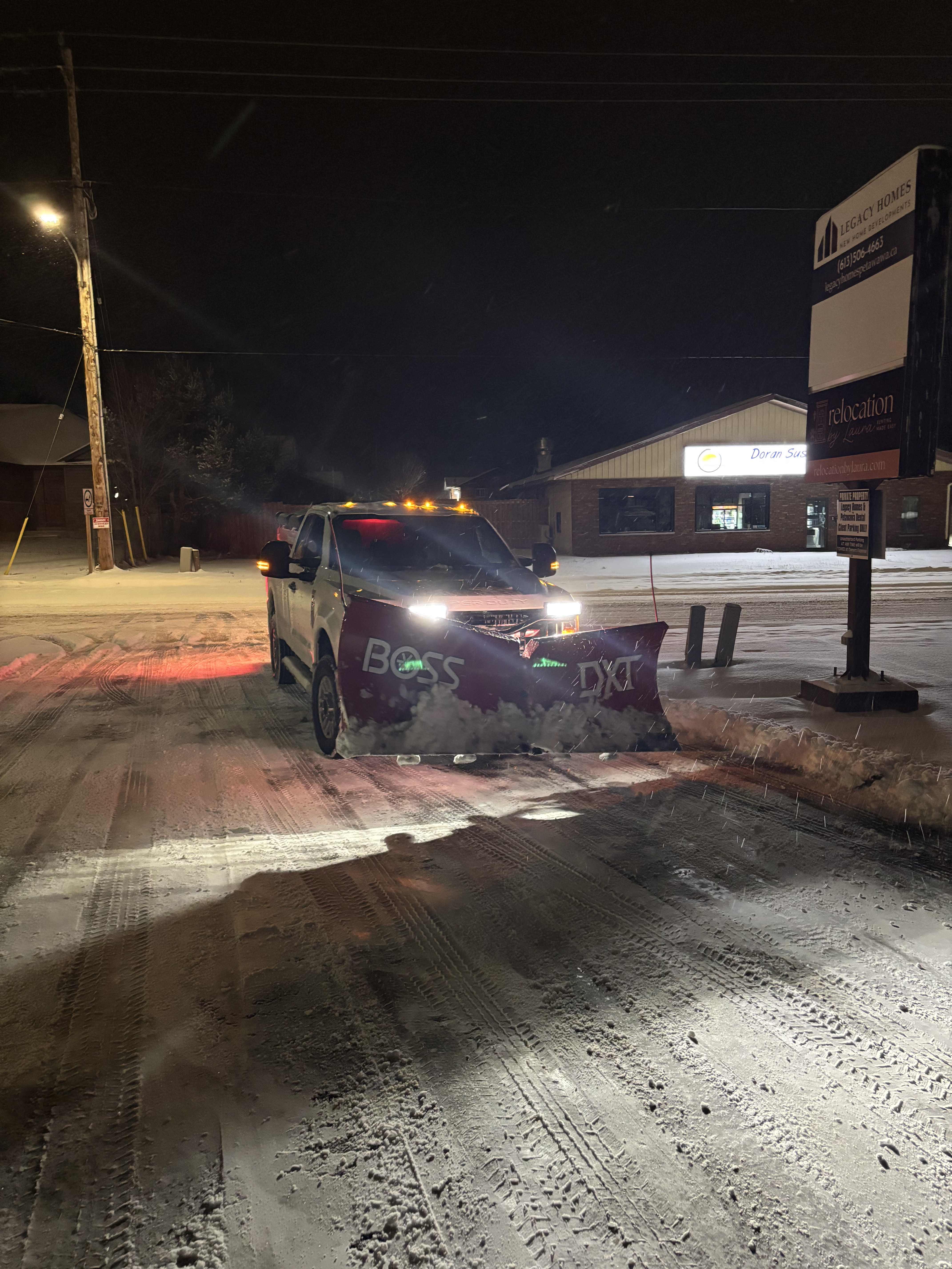 green and brown tractor on snow covered ground during daytime