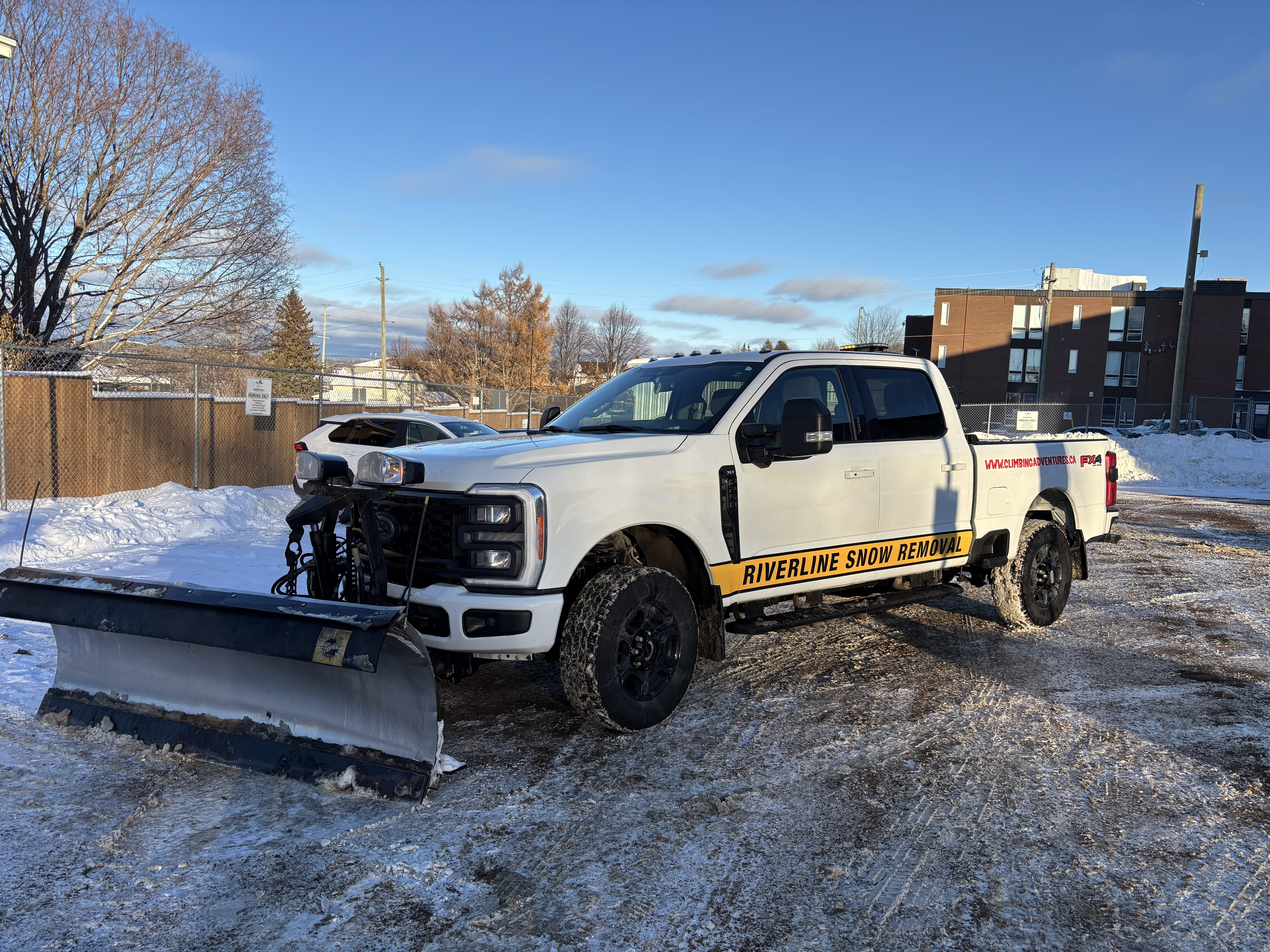 green and brown tractor on snow covered ground during daytime