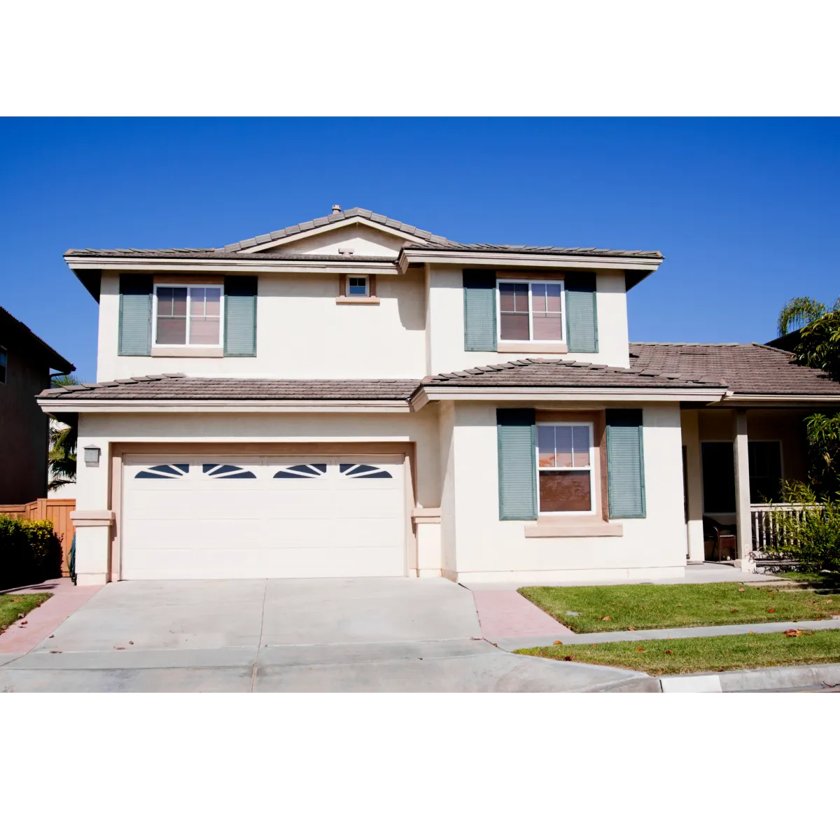 house with white stucco and three windows