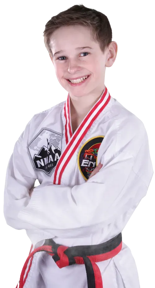 Boy training taekwondo in Evergreen Colorado improving confidence focus and self defense skills