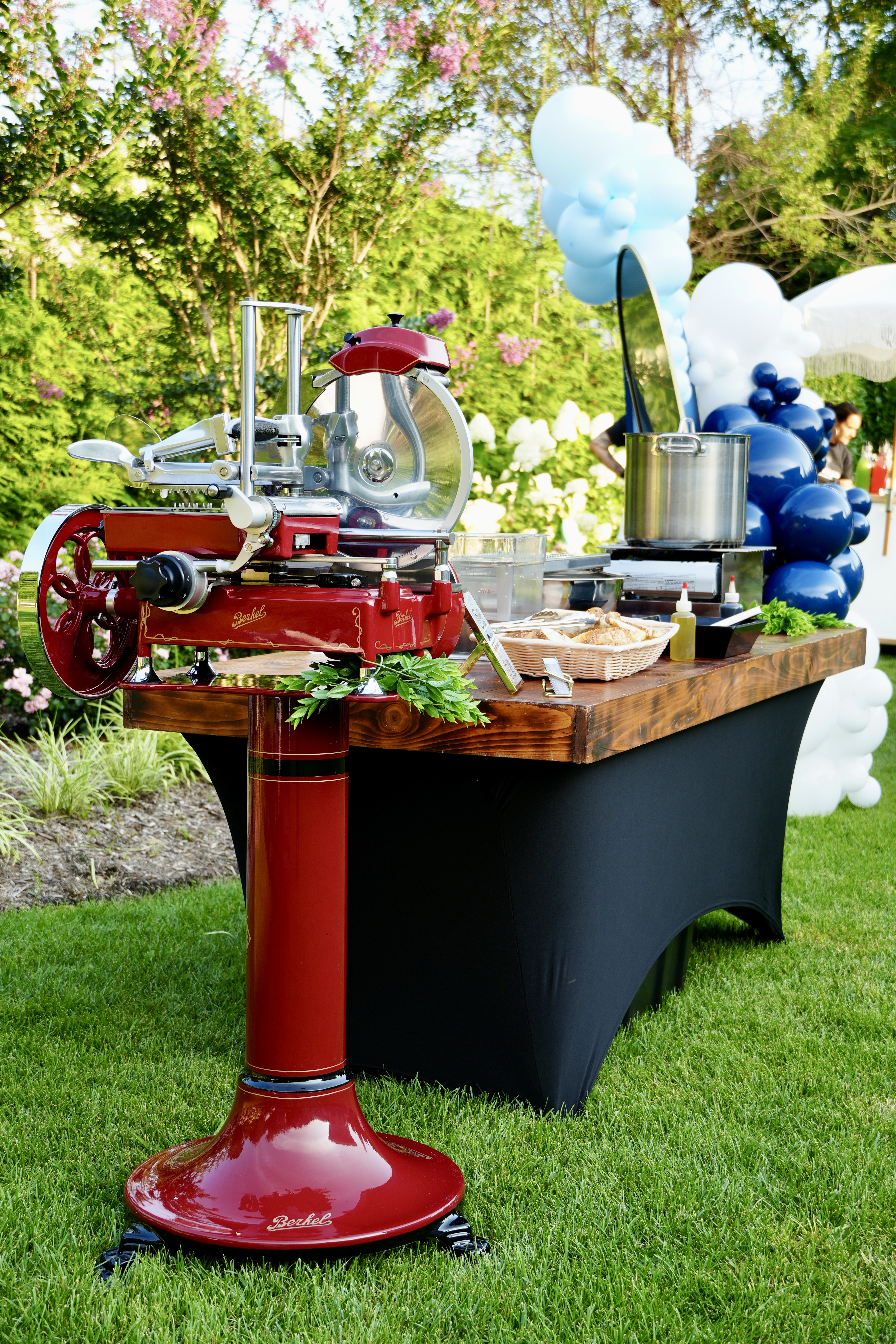 four people watching on white MacBook on top of glass-top table