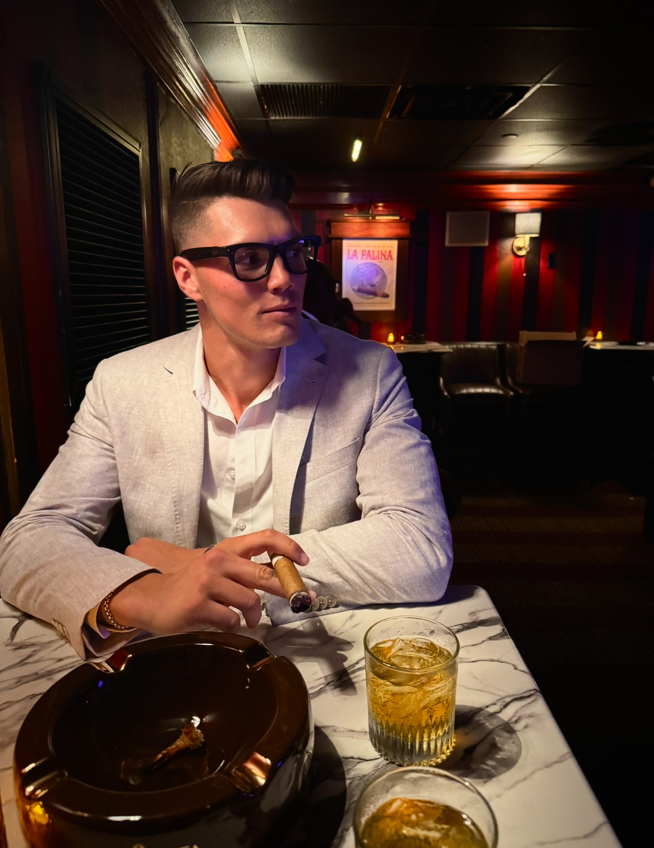 woman in white shirt using macbook