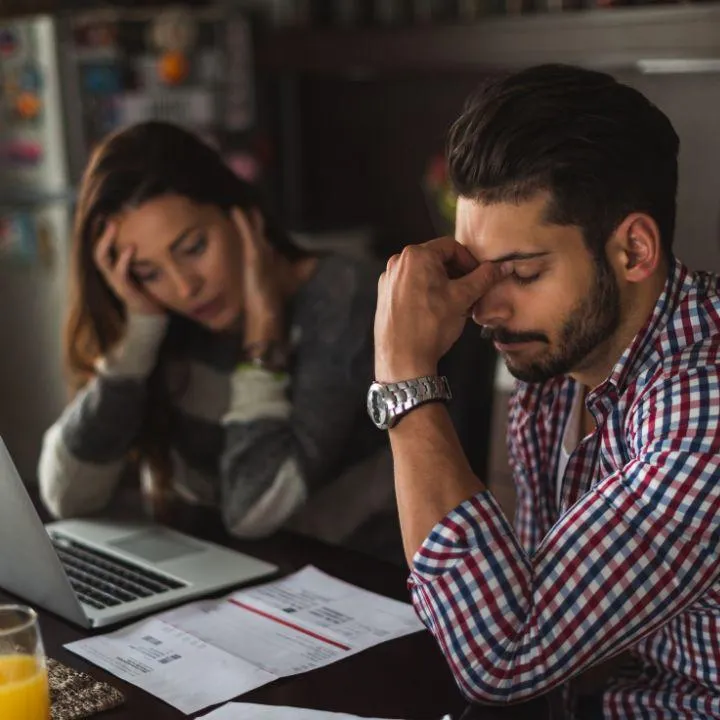 Man and wife worrying about foreclosure and mortgage modification