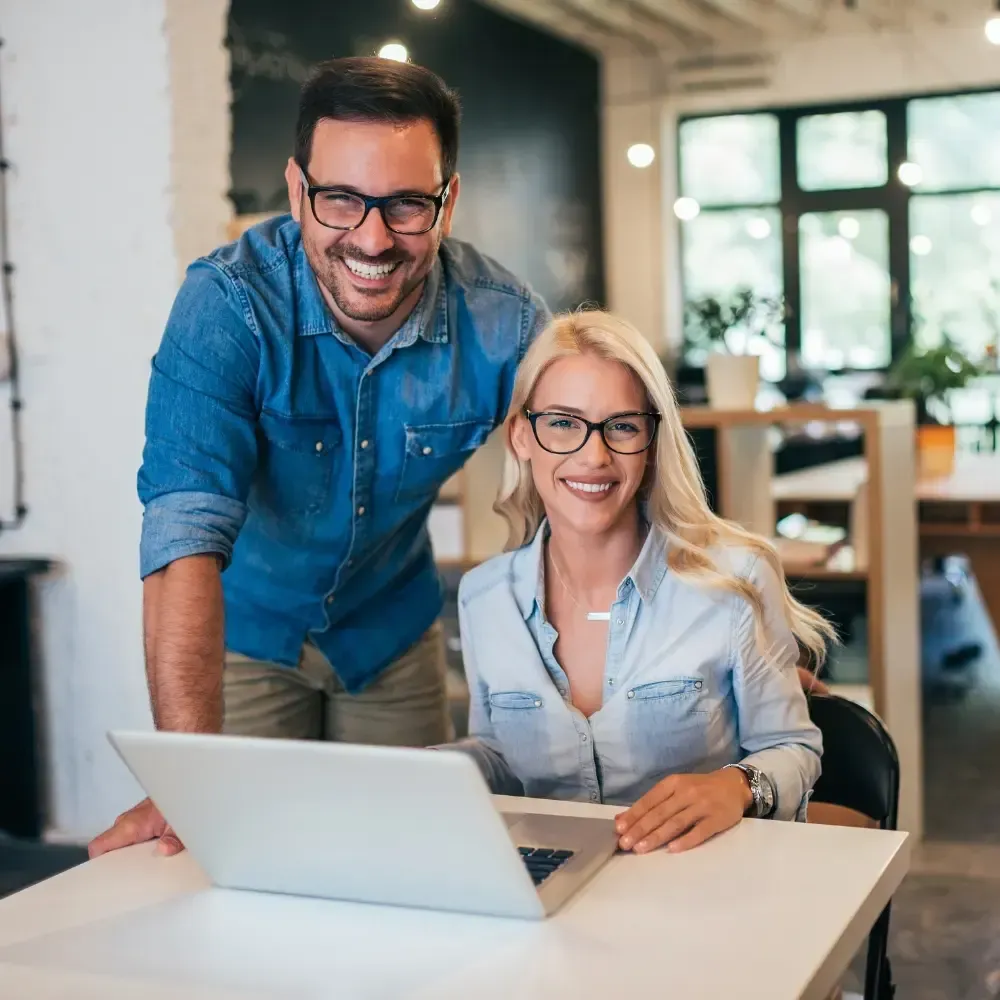 Landscape photo of a completed community water system with new storage tank and locals gathered nearby; bright daylight, clean engineering detail to illustrate a full sponsored project outcome for BlueHarbor Foundation.