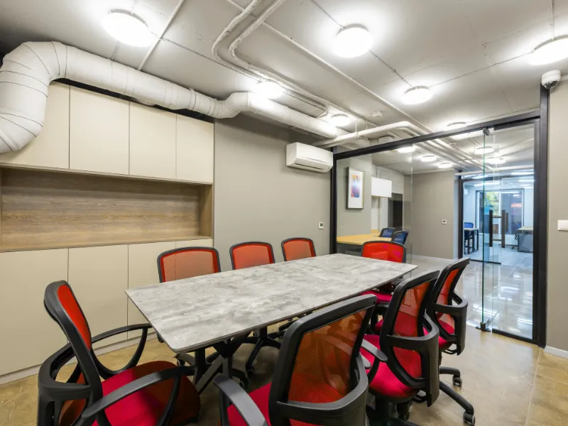 Small conference room with chairs neatly pushed in