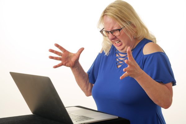 Tina frustrated and disgruntled by her computer