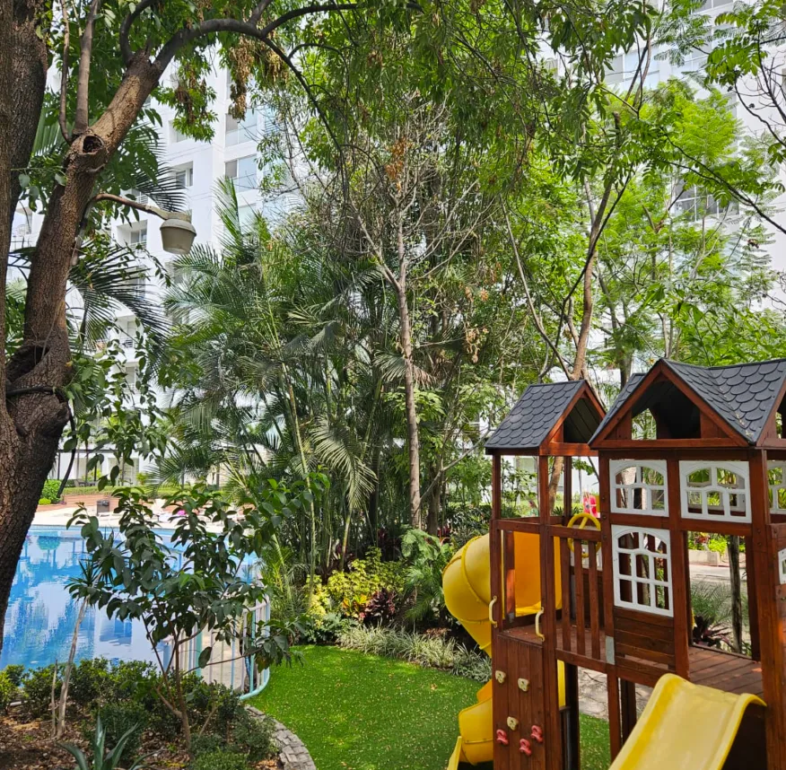white and grey concrete building near swimming pool under clear sky during daytime