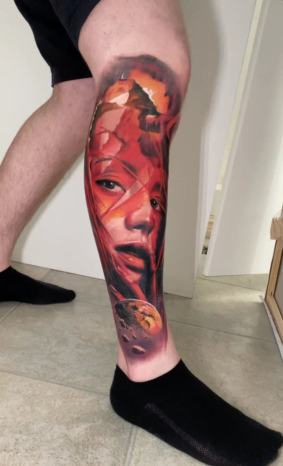 person with tattoo on right arm