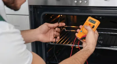 Oven repair service fixing heating and temperature issues for a residential oven.