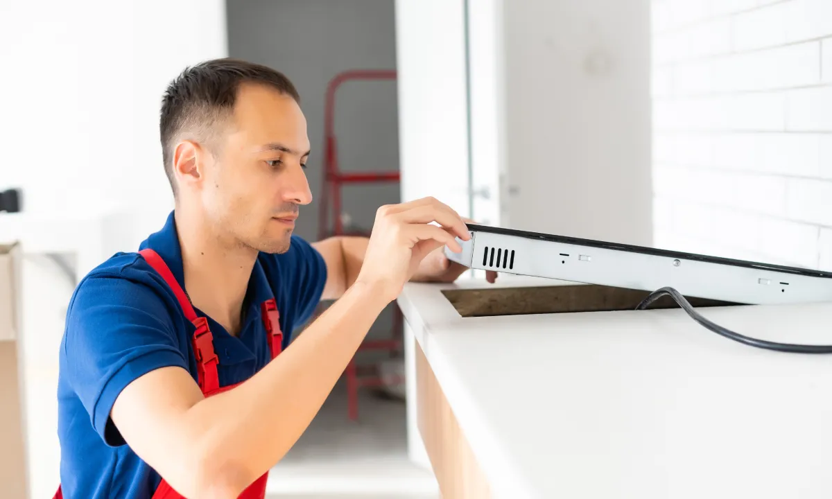 Technician installing a brand-new stove in Alexandria, VA