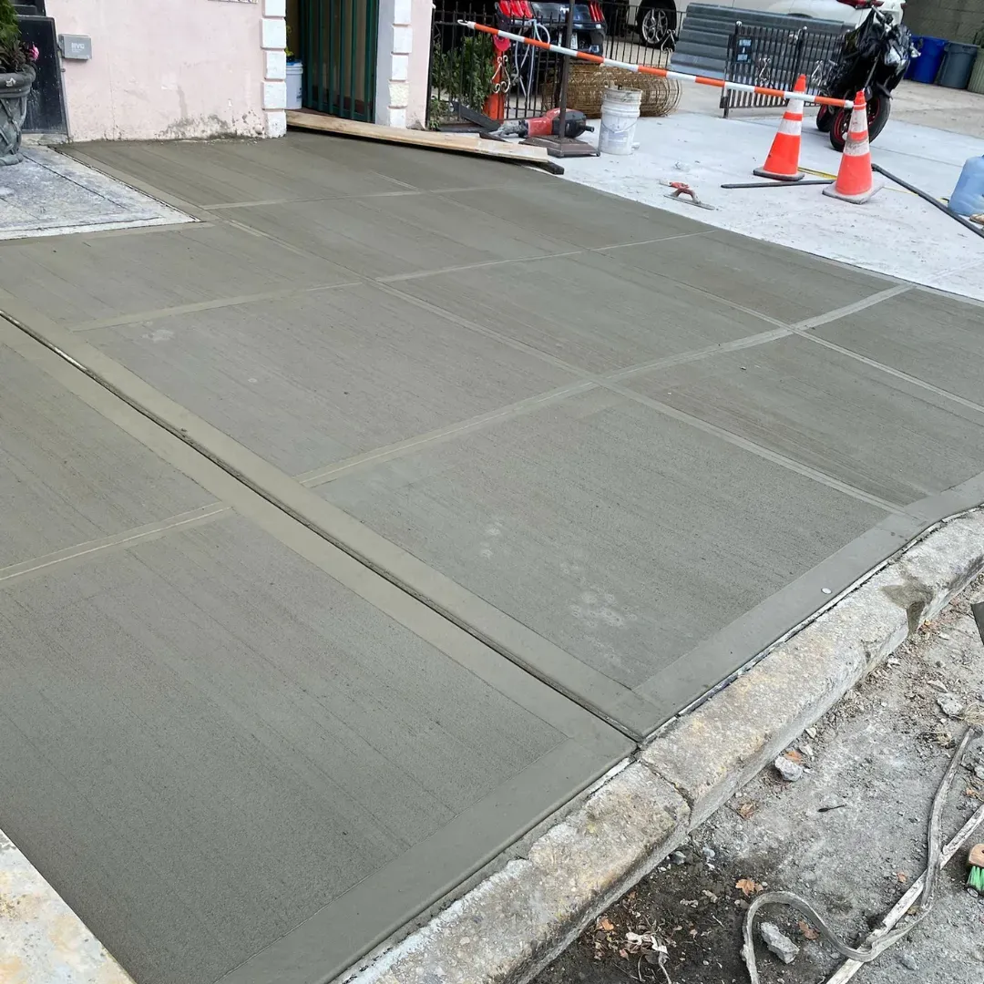 New broom finish concrete driveway at a property in Queens, New York.