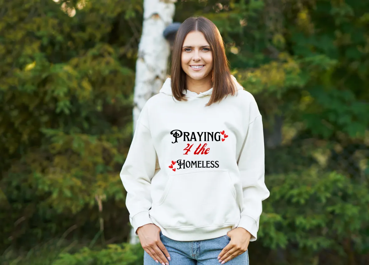 A smiling young woman in a deep red hoodie stands in front of a mural of Colorado mountains, holding a folded stack of t-shirts. The background is softly blurred, and the style is clean, modern, and inviting.