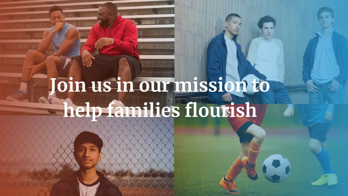 A warm, accessible therapy room with natural light, a diverse young adult using assistive technology while a caregiver smiles supportively nearby.