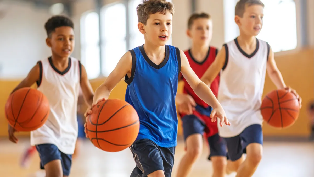 A welcoming reception area with soft blue and yellow decor, a friendly staff member at the desk, natural light streaming in, 3:2 aspect ratio, interior design style.