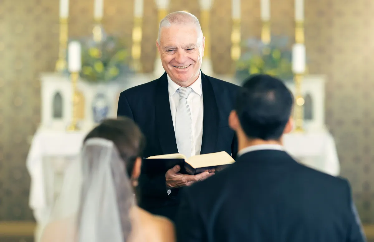 wedding-priest-and-couple-at-the-altar