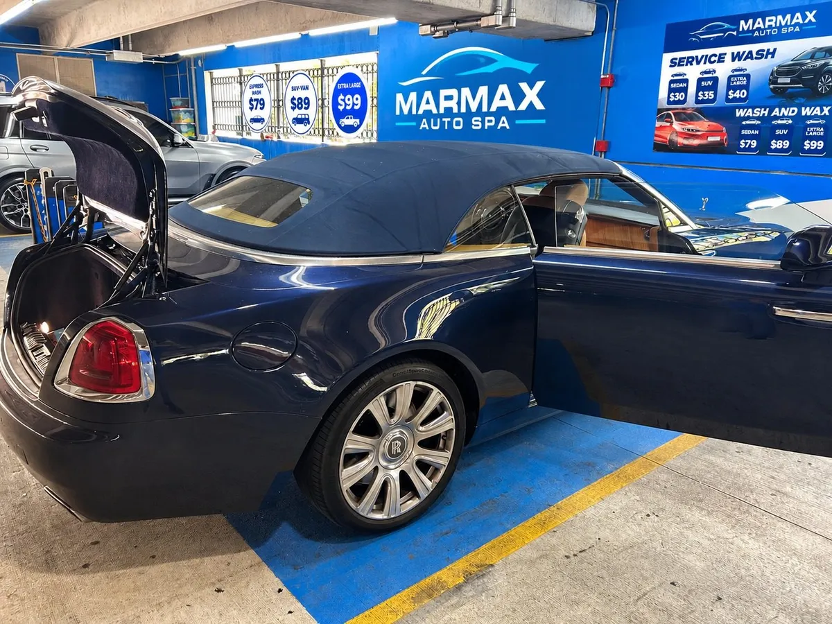 Rolls-Royce Dawn convertible being detailed in front of the MarMax sign