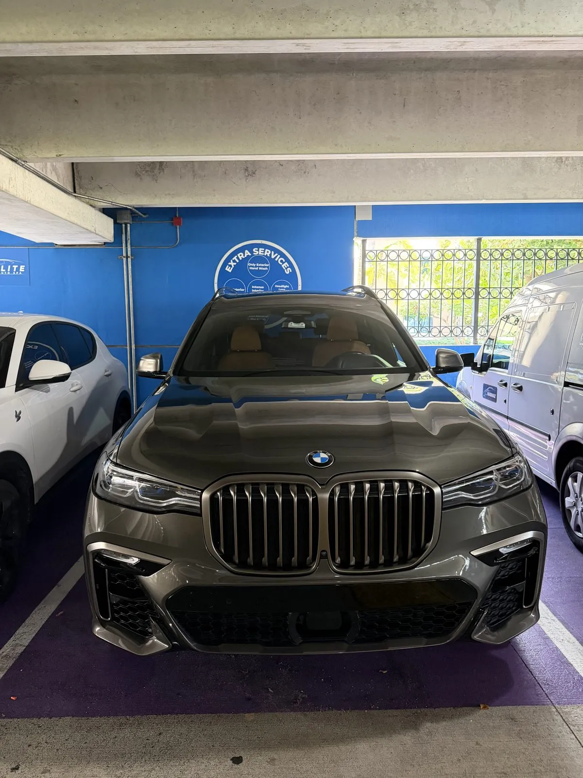 Black BMW X7 freshly washed in the MarMax bay