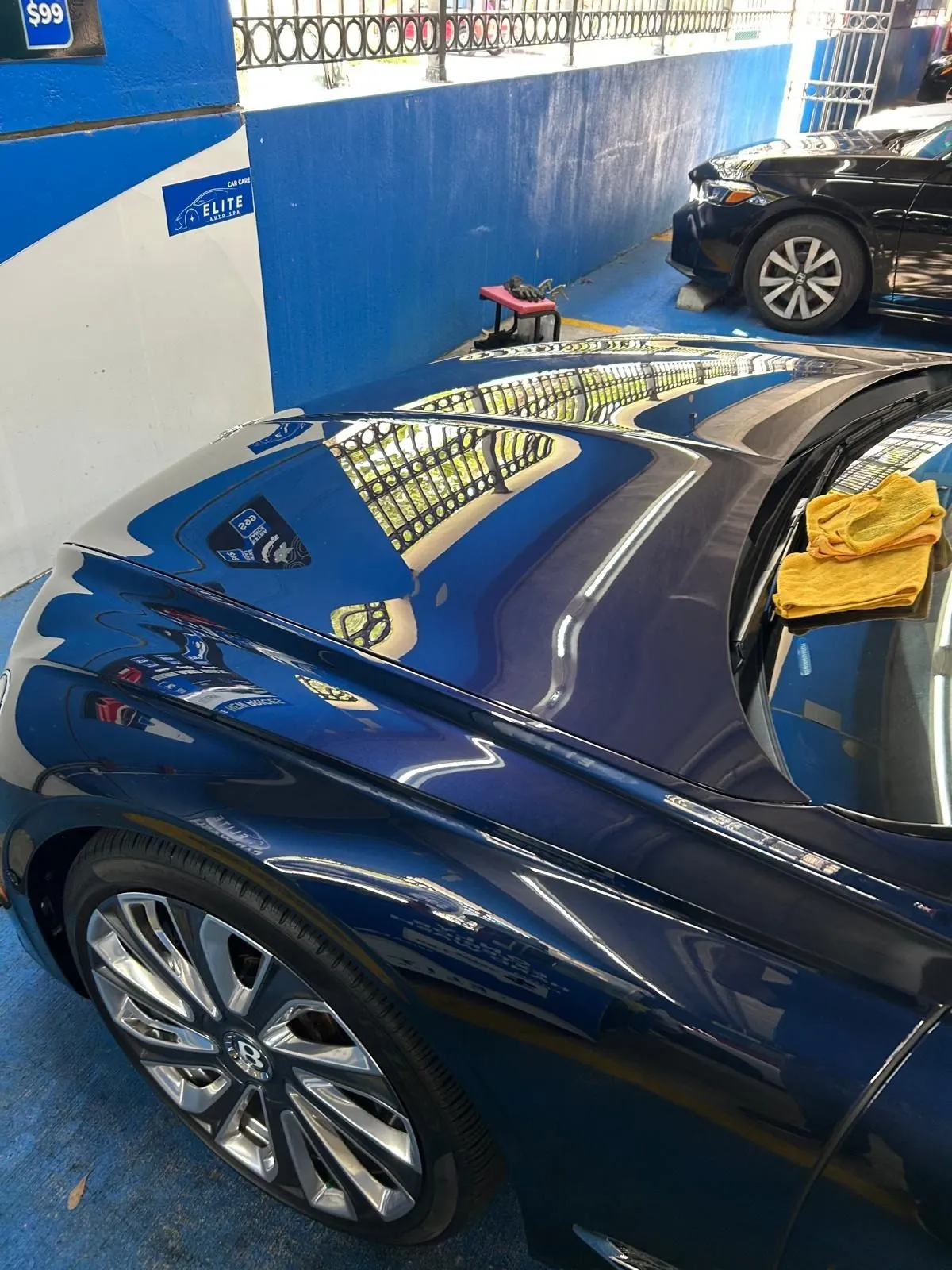 Glossy blue paint and wheel after detailing