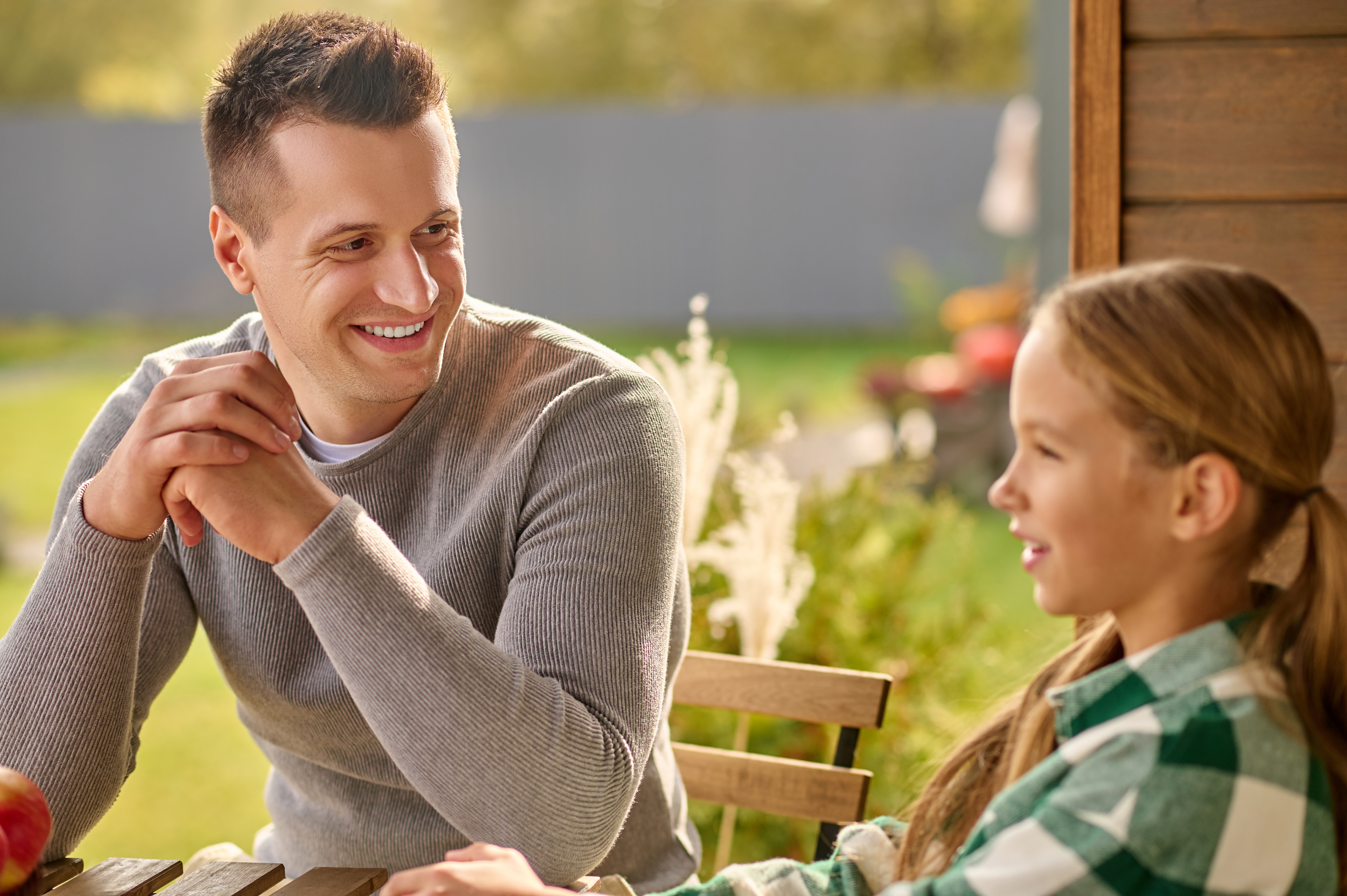 A parent and child spending time together in conversation.
