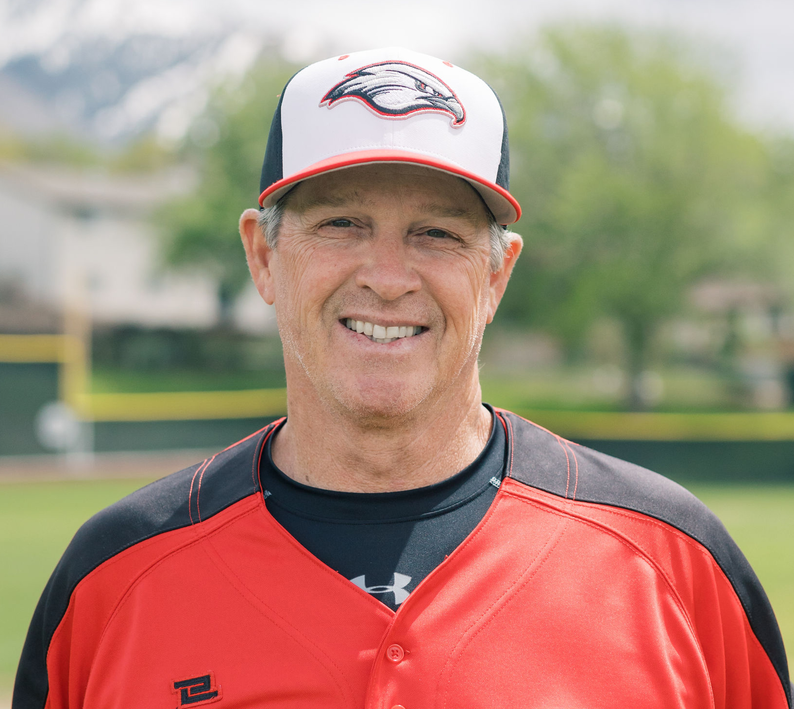 Portrait of Coach Connelly in his red baseball uniform