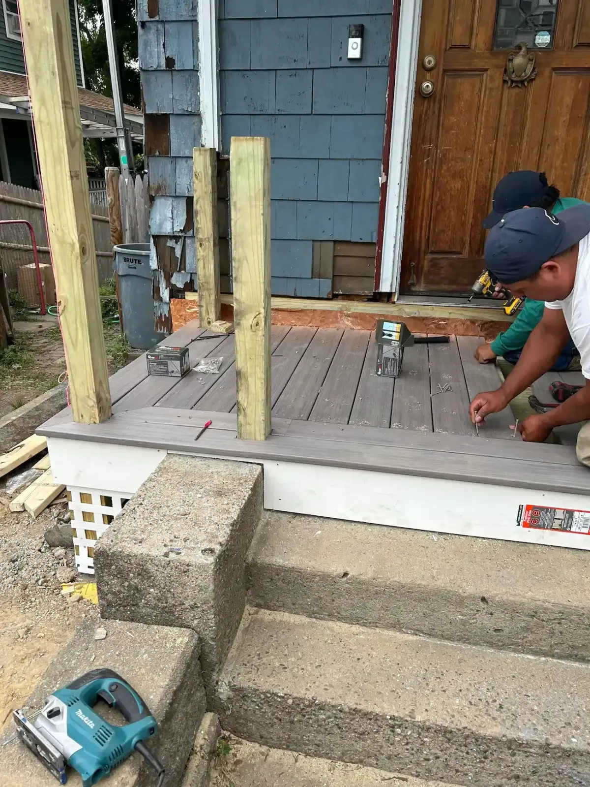 Custom composite deck installation on a Lynn, MA home with durable low-maintenance decking.