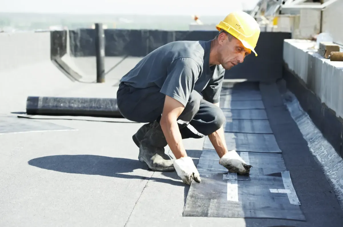 Professional flat roof installation and waterproofing on a property in Lynn, MA.