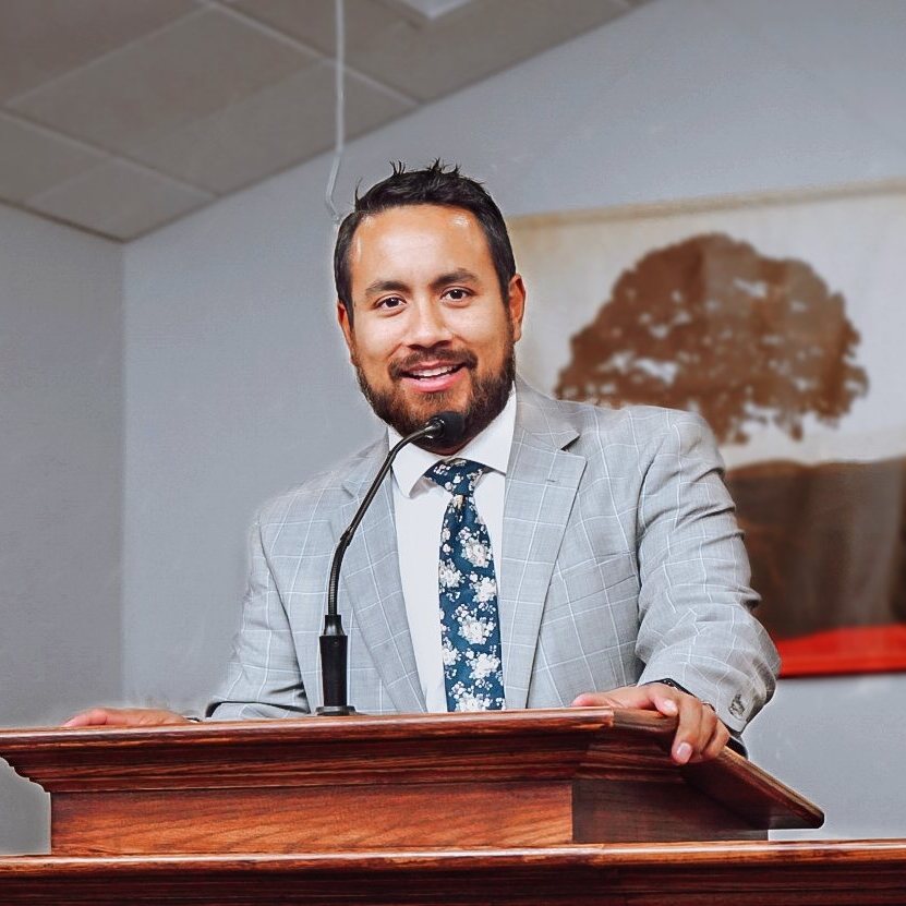 Pastor at the pulpit delivering a Bible message
