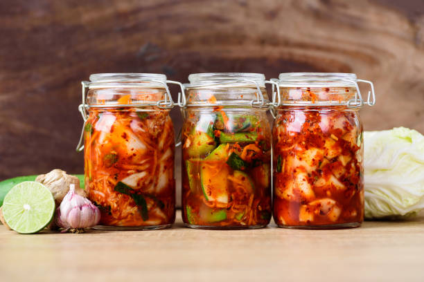kimchi fermenting in glass jars