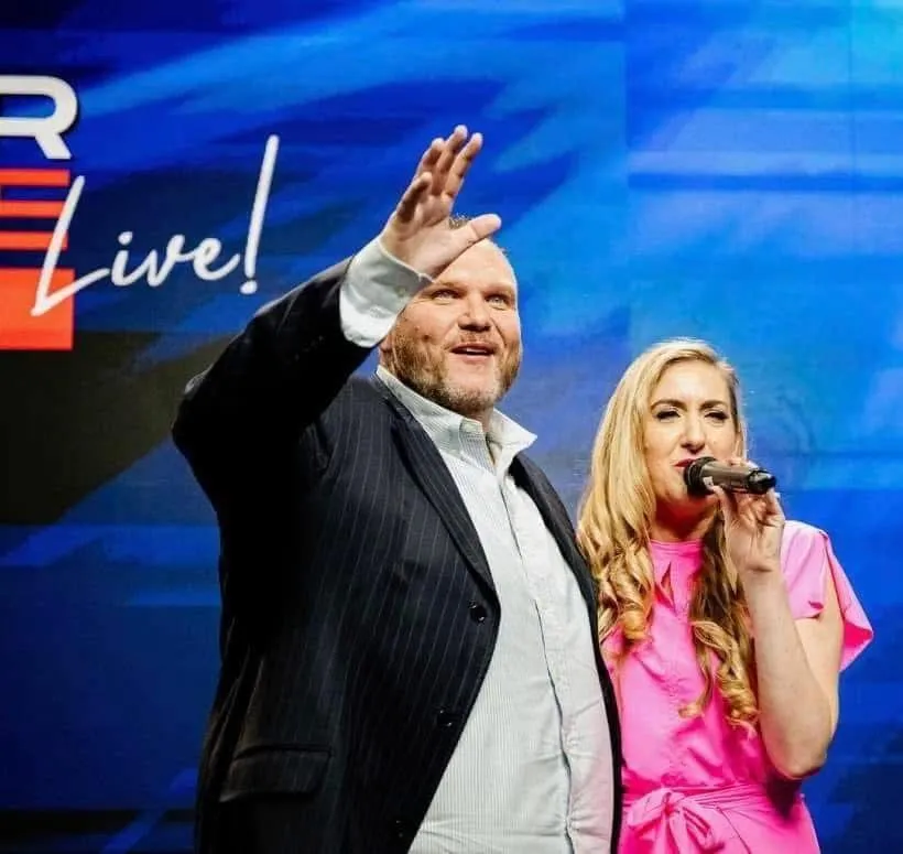 a tree trunk covered in vines in a forest
