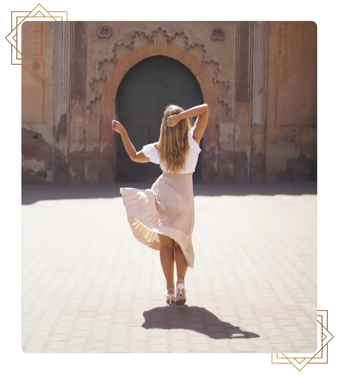 Woman walking toward an ornate archway in sunlight, symbolizing stepping away from misaligned business and starting a new chapter in business coaching for established consultants.
