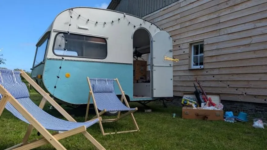 A person standing on top of a mountain