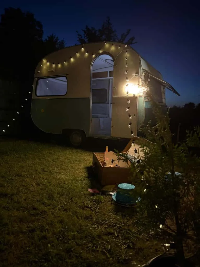 a lone tree on the top of a mountain