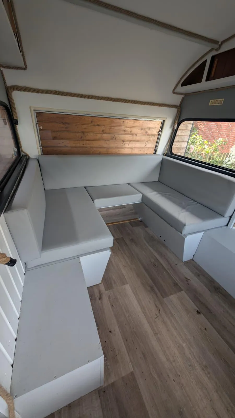 a lone tree on the top of a mountain