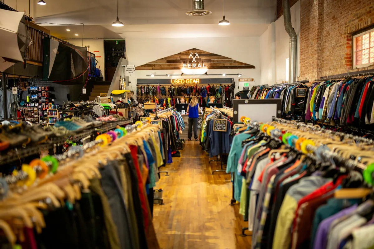Racks of secondhand clothing in a consignment boutique