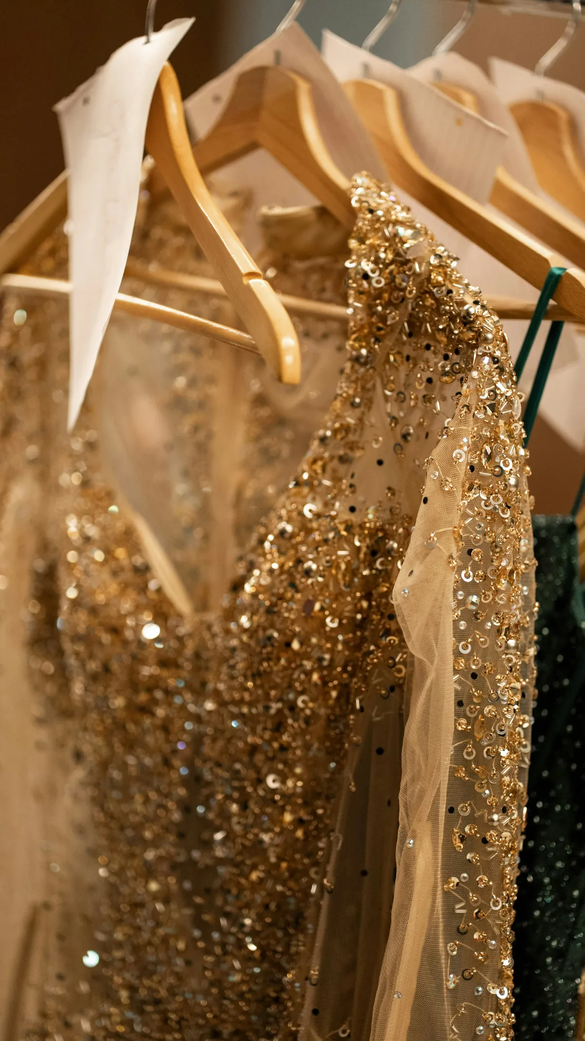 Sequined evening dresses on hangers
