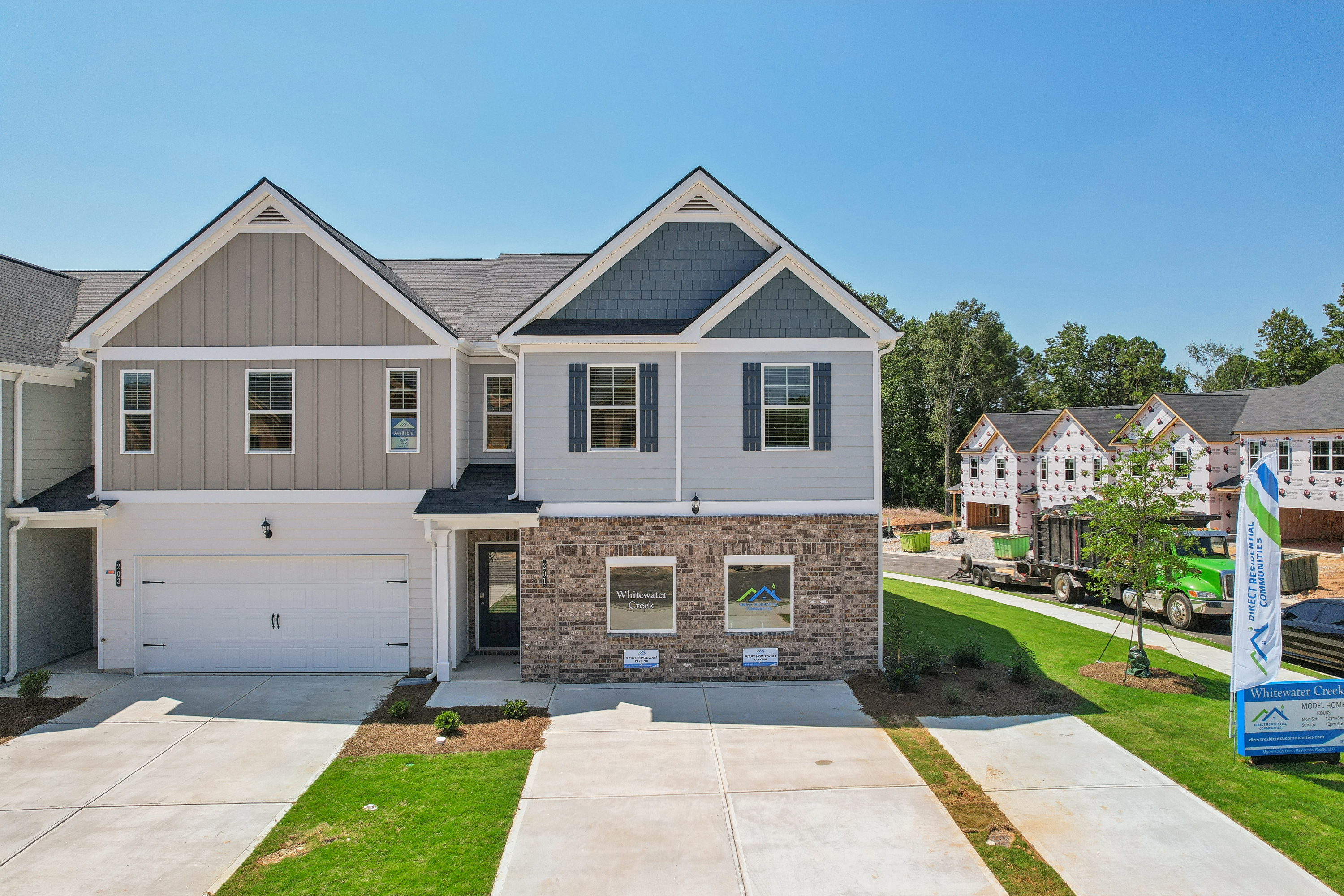 Luxurious newly constructed luxury home exterior under clear sky, architectural photography