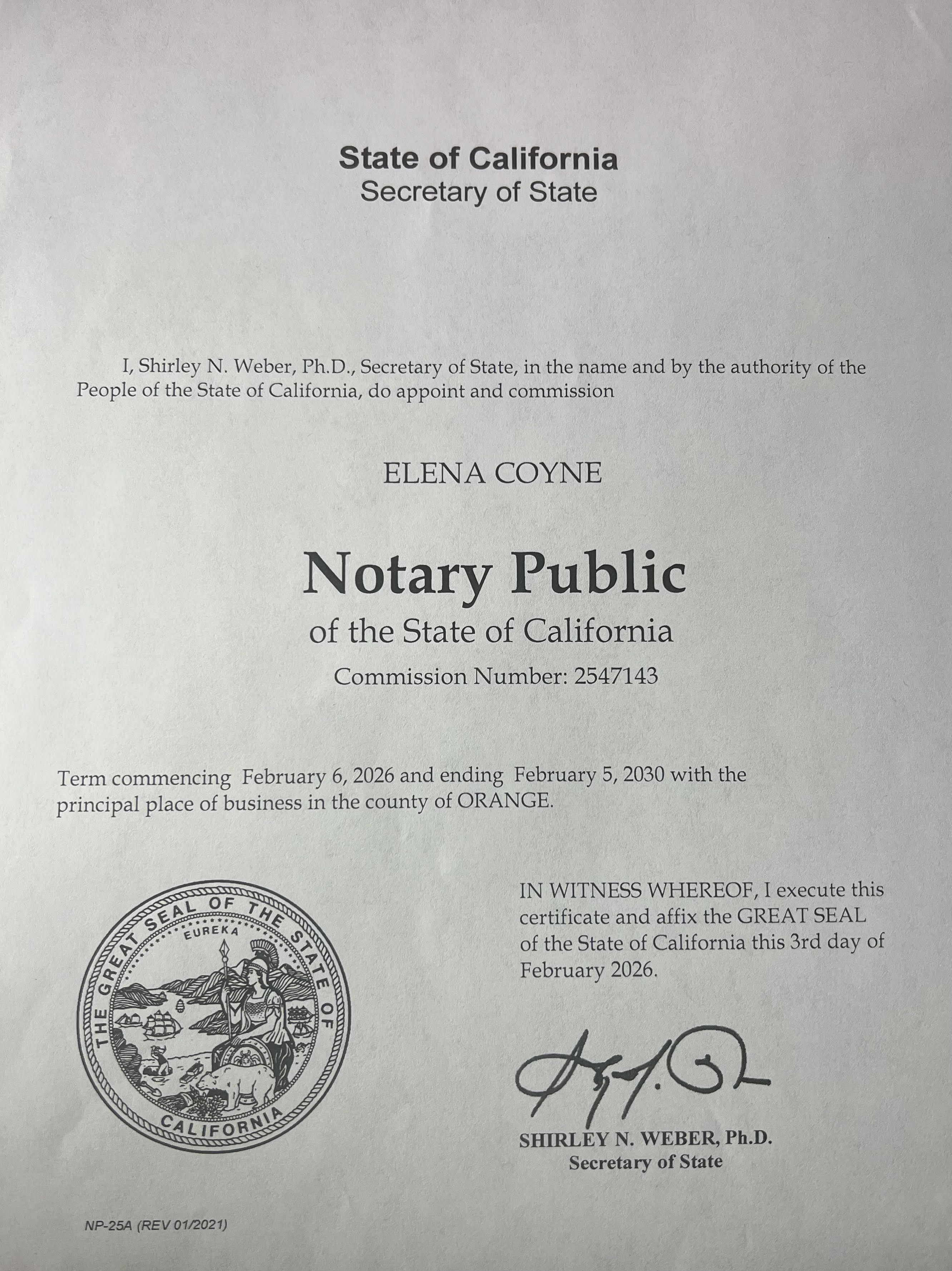 a person writing on a piece of paper