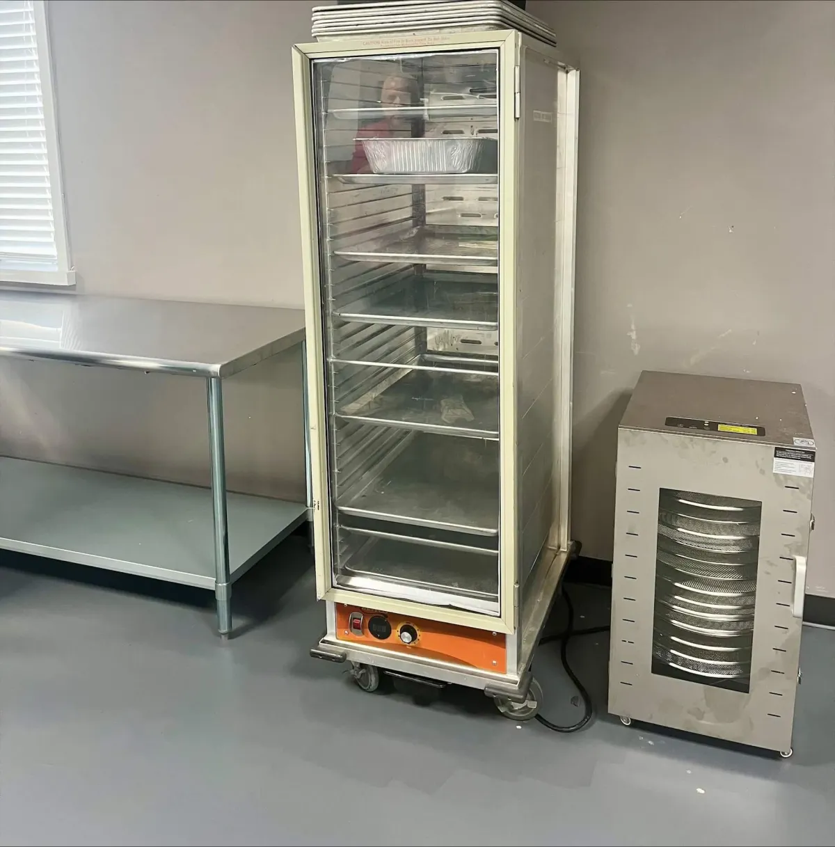 person sheeting dough