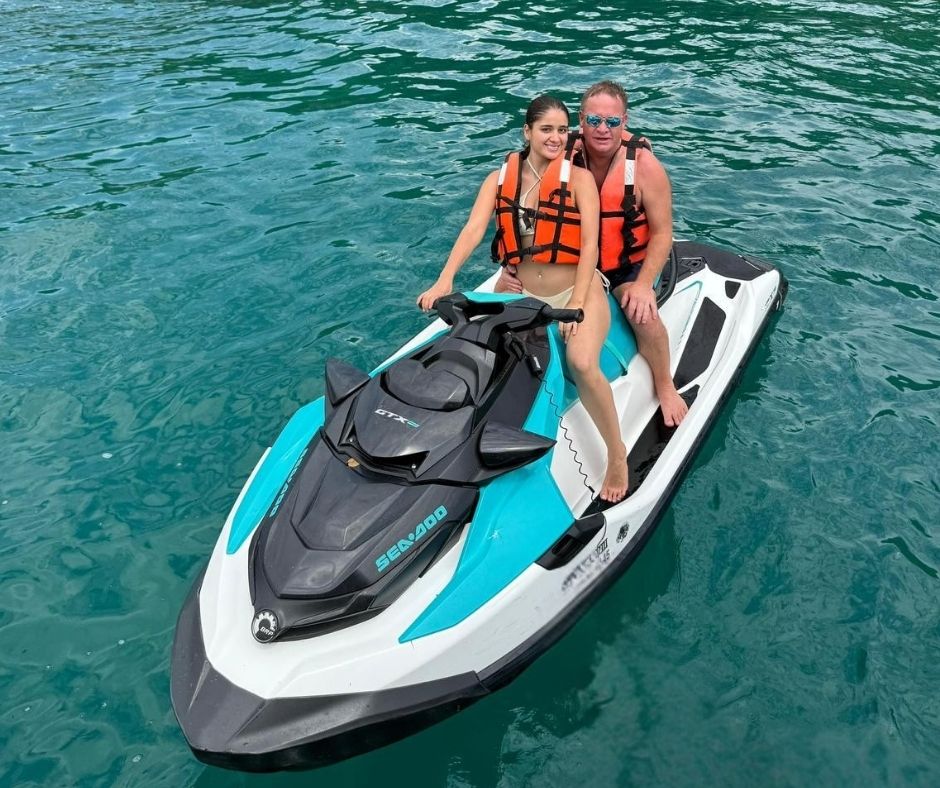 High-performance jet ski next to yacht