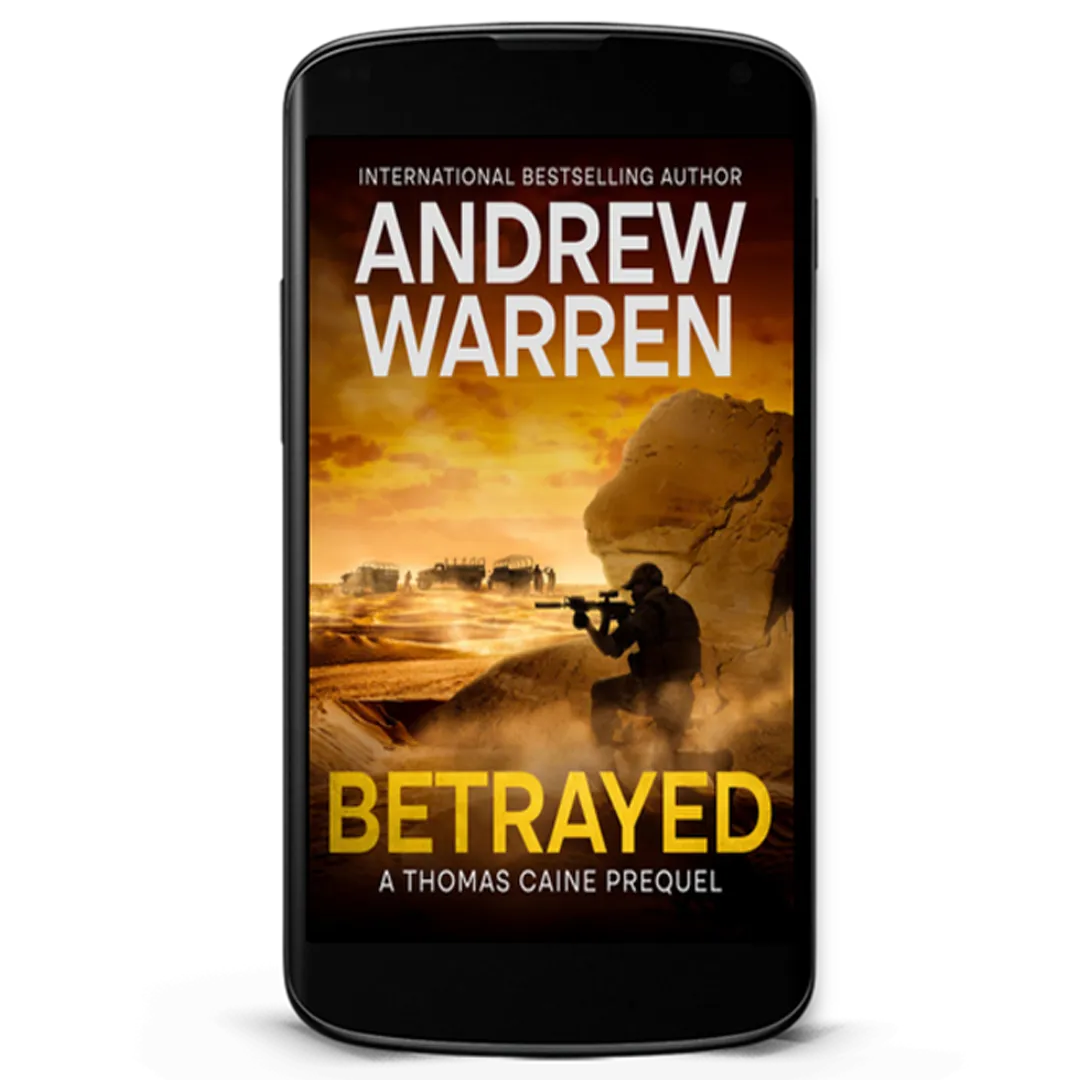 Book Cover: Betrayed by Andrew Warren. Silhouette of a military man aiming a rifle and hiding behind a rock outcrop in Afghanistan.