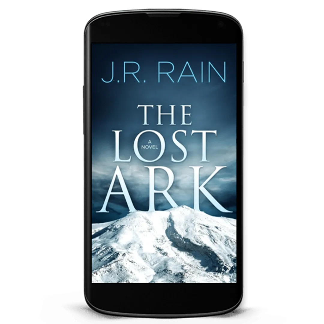 Book Cover: The Lost Ark by J.R. Rain. The top of a glacier with a mountain range under blue sky in the background.