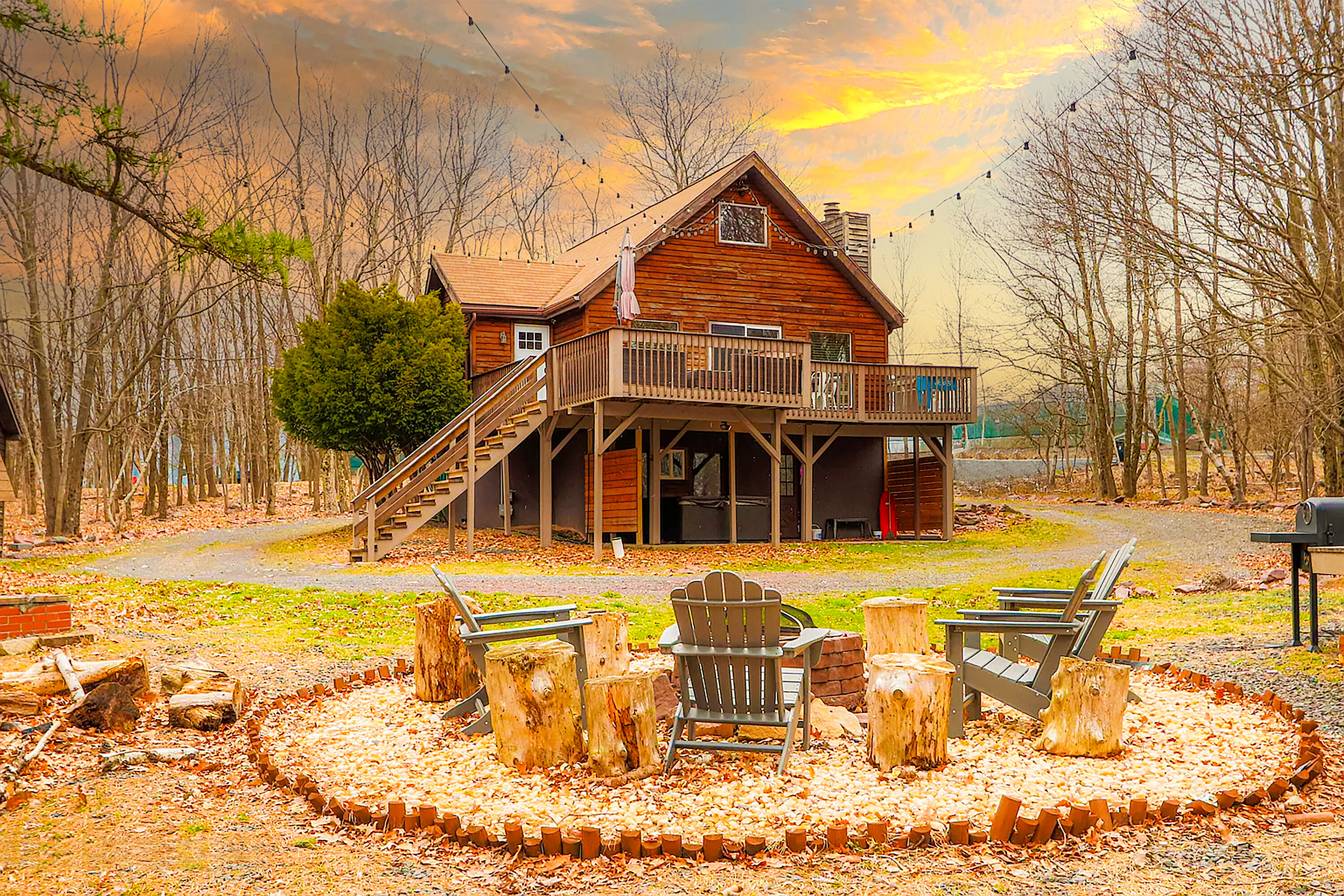 Exterior view at golden hour: the three-suite chalet framed by evergreens, calm lake visible beyond a private dock, soft warm light highlighting minimalist white-and-gray facade and forest-green accents, photorealistic style emphasizing serenity and privacy.