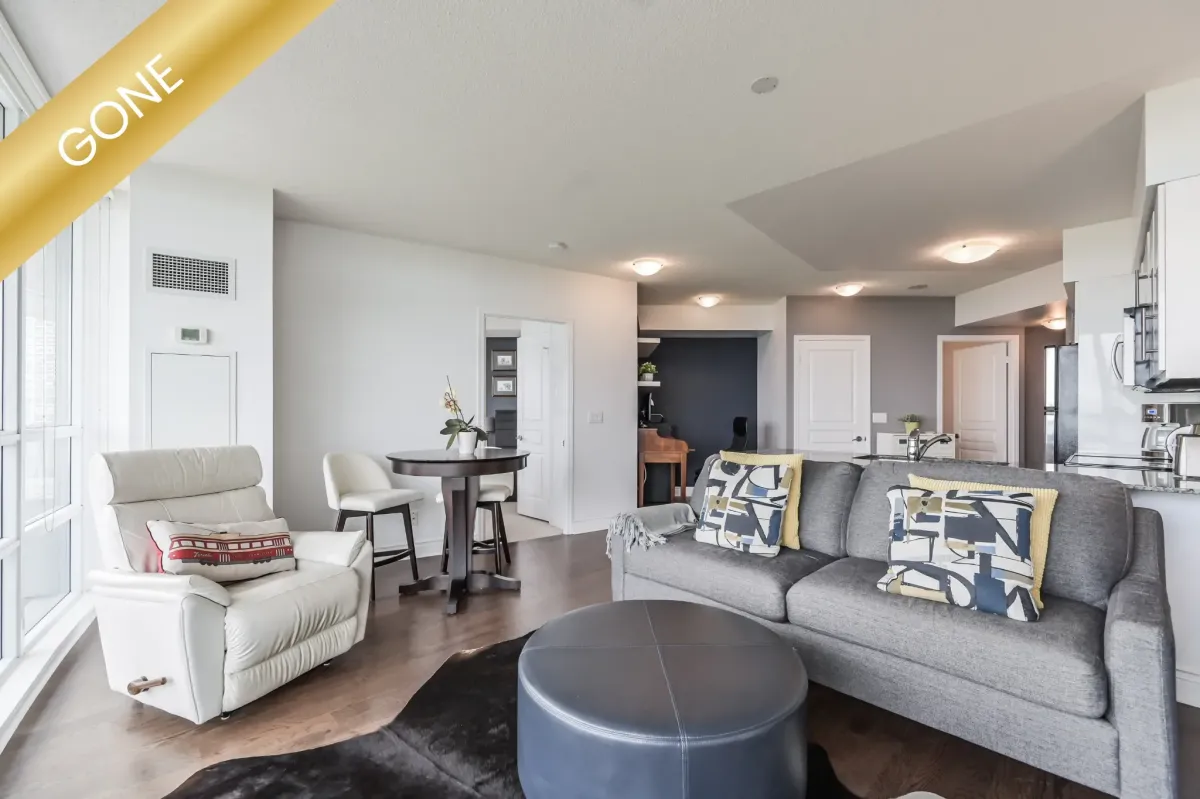 Bright residential condo at 2230 Lake Shore Blvd W #908, Etobicoke, Ontario, featuring floor-to-ceiling windows and city views.