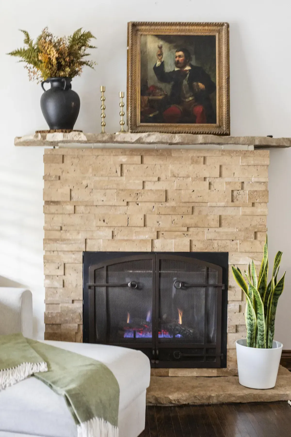 Front living room at 109 Fairleigh Ave S Hamilton featuring restored original hardwood floors, gas fireplace, with natural light.