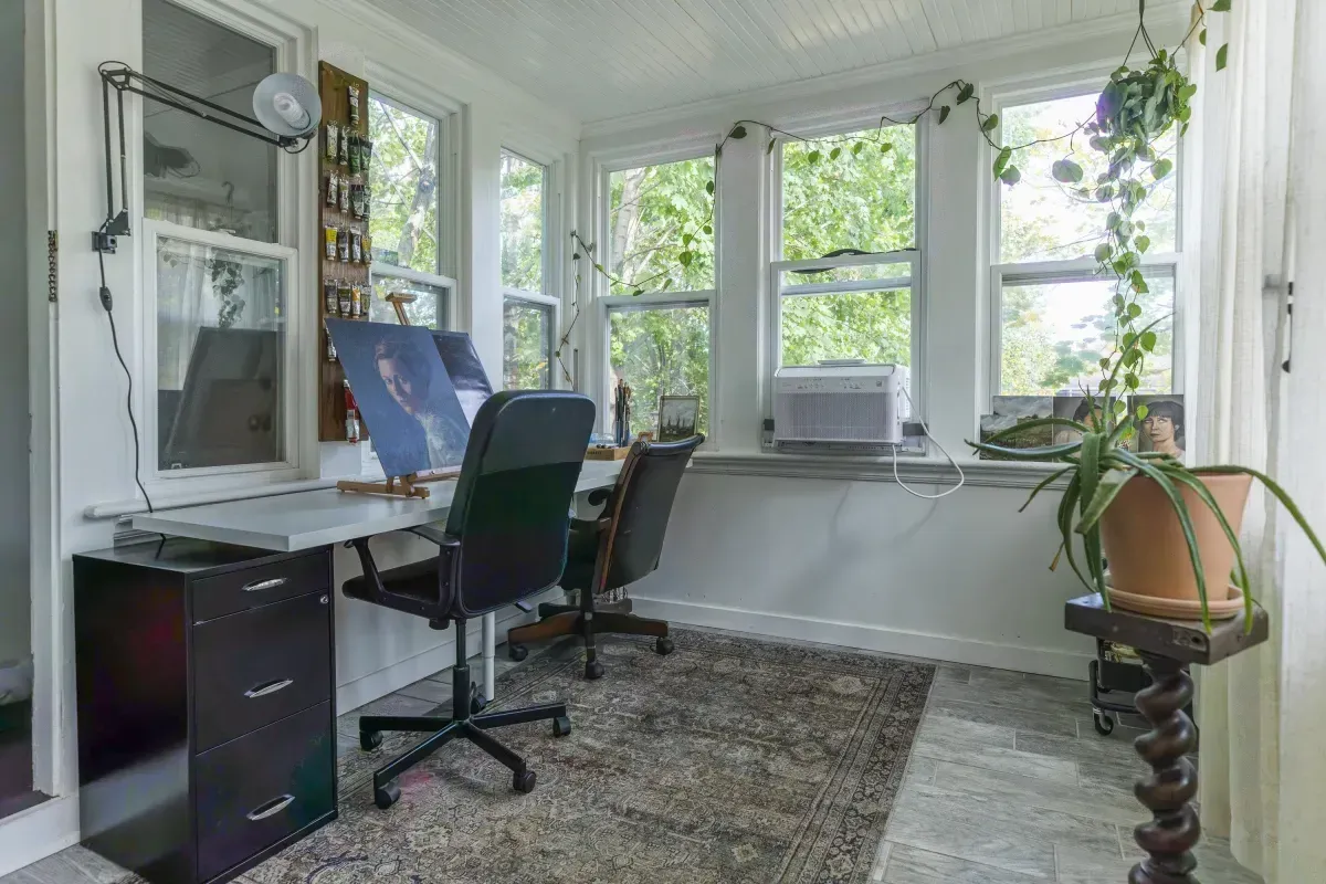 Dedicated home office at 109 Fairleigh Ave S, featuring bright windows—perfect for remote work.