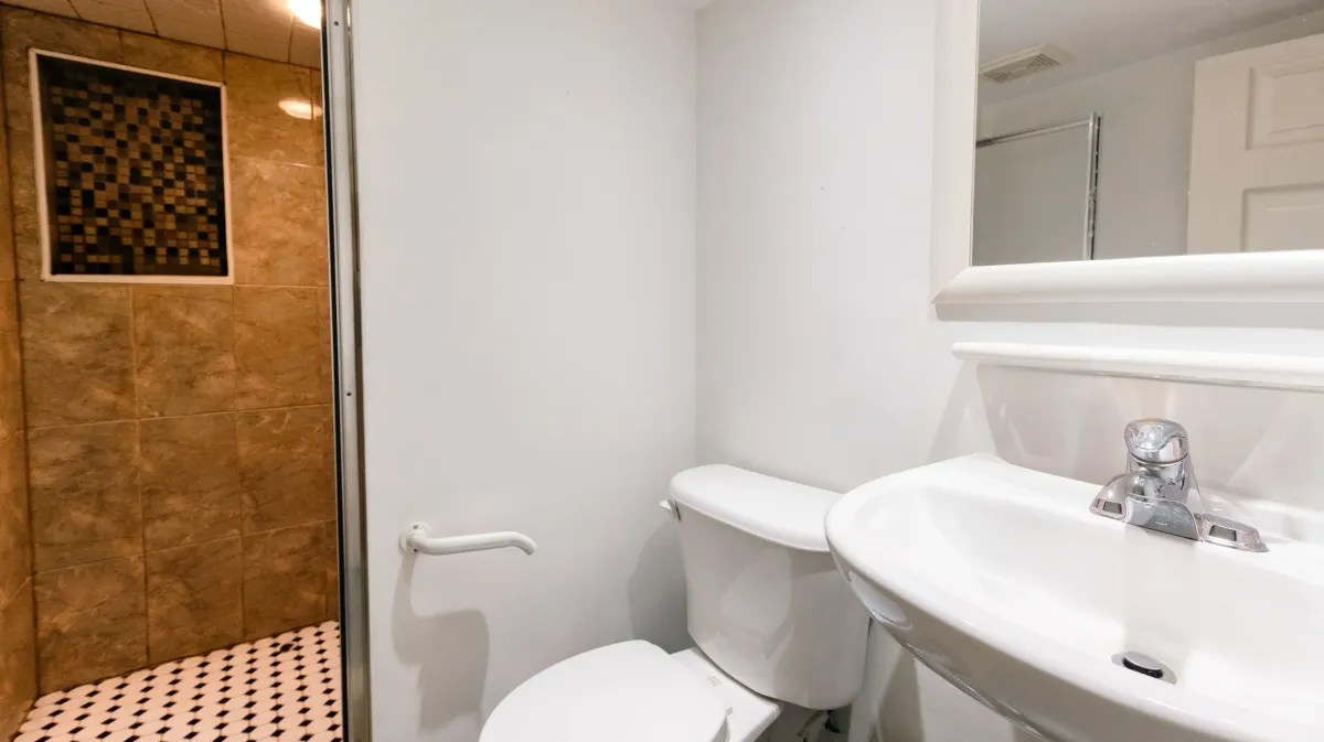 Functional 3-piece bathroom located in the finished lower level of 81 Lambton Ave.