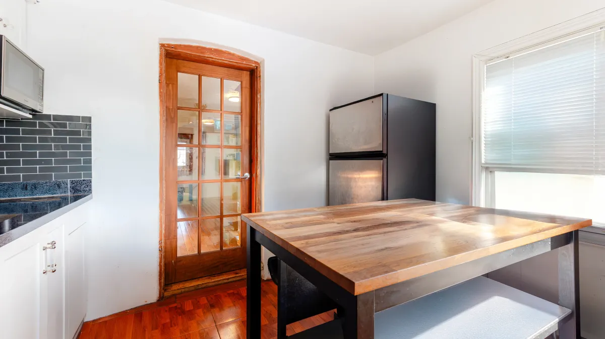 Sun-filled dining space at 81 Lambton Ave, showing the seamless flow of this detached Toronto bungalow.