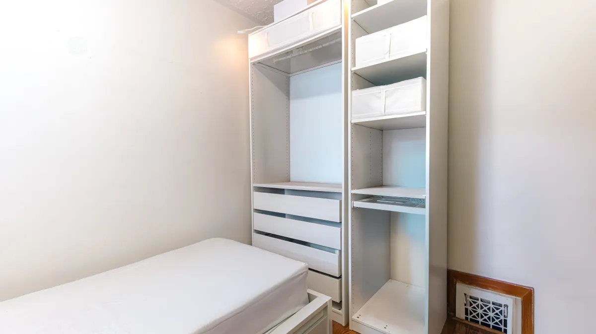 Second main floor bedroom at 81 Lambton Ave, perfect for a nursery or home office in the West End.