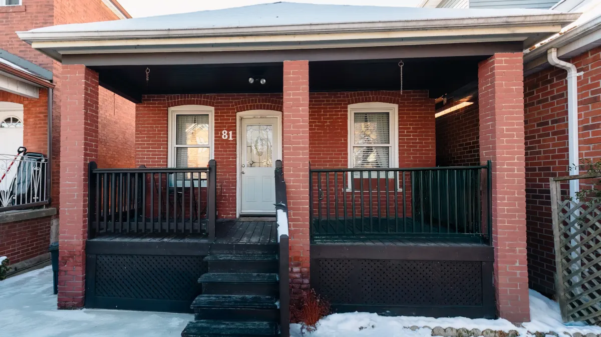 Front view of 81 Lambton Ave, a detached bungalow in Rockcliffe-Smythe with two dedicated front-yard parking spaces.