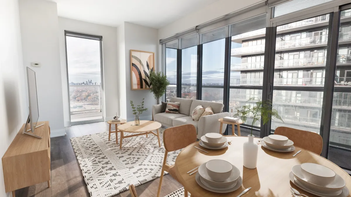 Sun-filled open-concept living space at 56 Annie Craig Dr #3408 featuring soaring floor-to-ceiling windows.